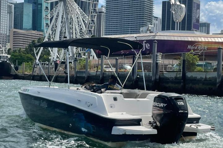 a boat in the water with a city in the background